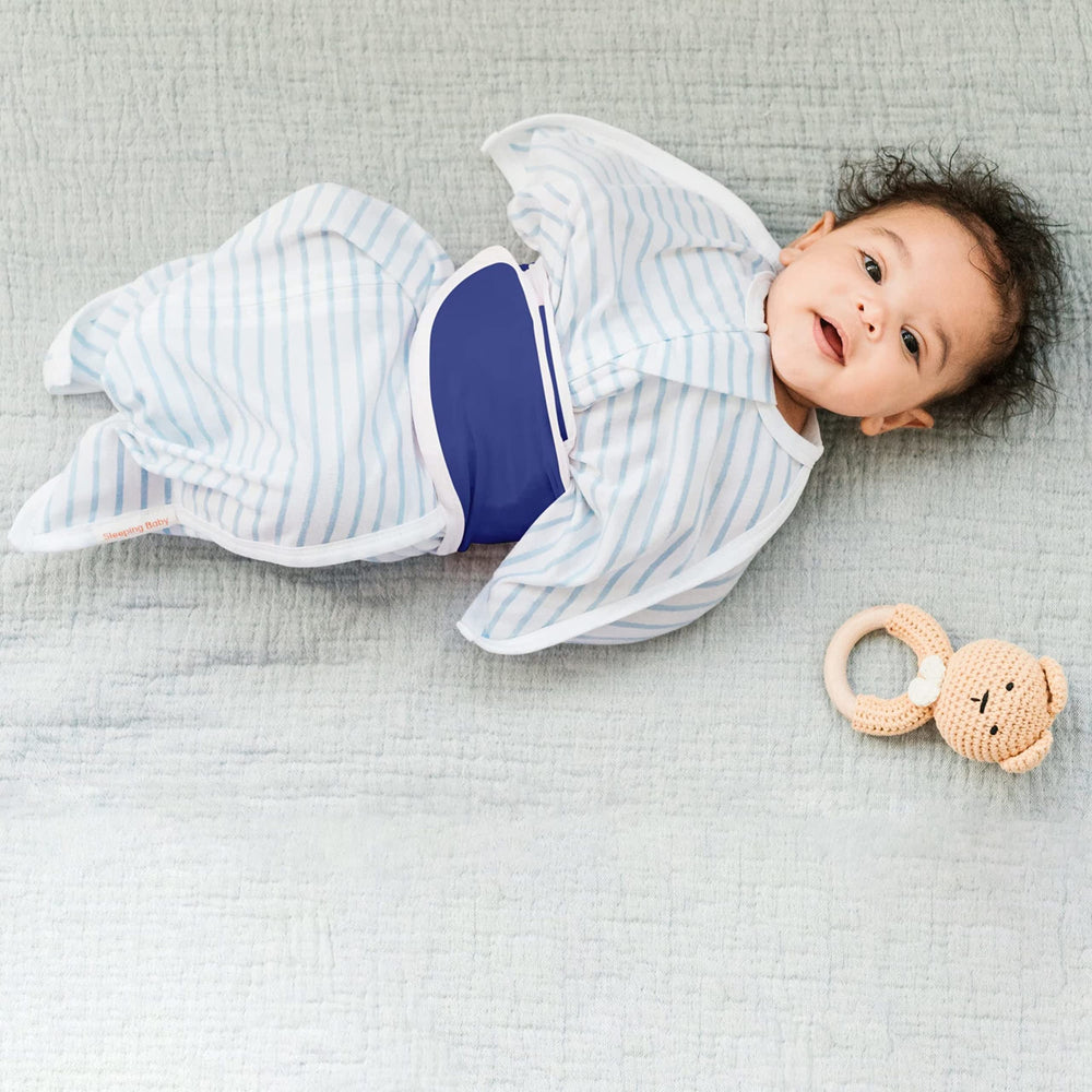 SleepingBaby Snuggle Strap wrapped around baby showing adjustable fit and comfort