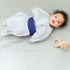 SleepingBaby Snuggle Strap wrapped around baby showing adjustable fit and comfort