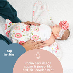 SleepingBaby Zippy Swaddle on baby in nursery highlights safe sleep environment benefits.