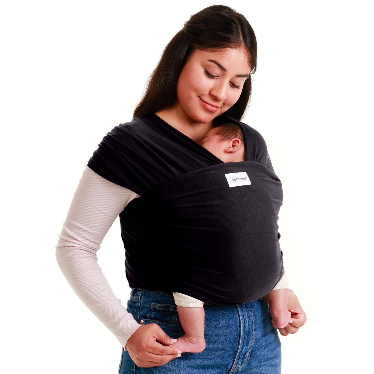 Sleepy Wrap black-wearer with tied knot enables hands-free baby carrying.