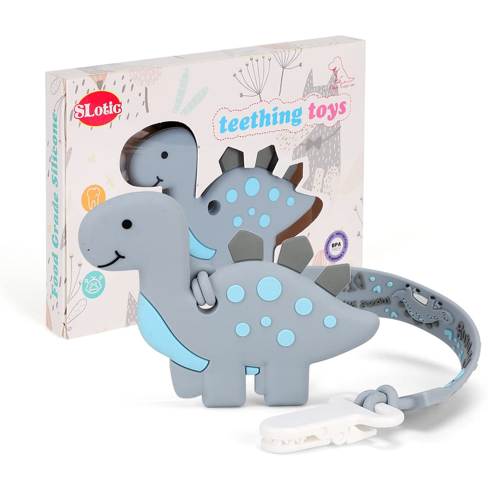 Slotic dinosaur teether in hands showing easy-grip design for tiny fingers.