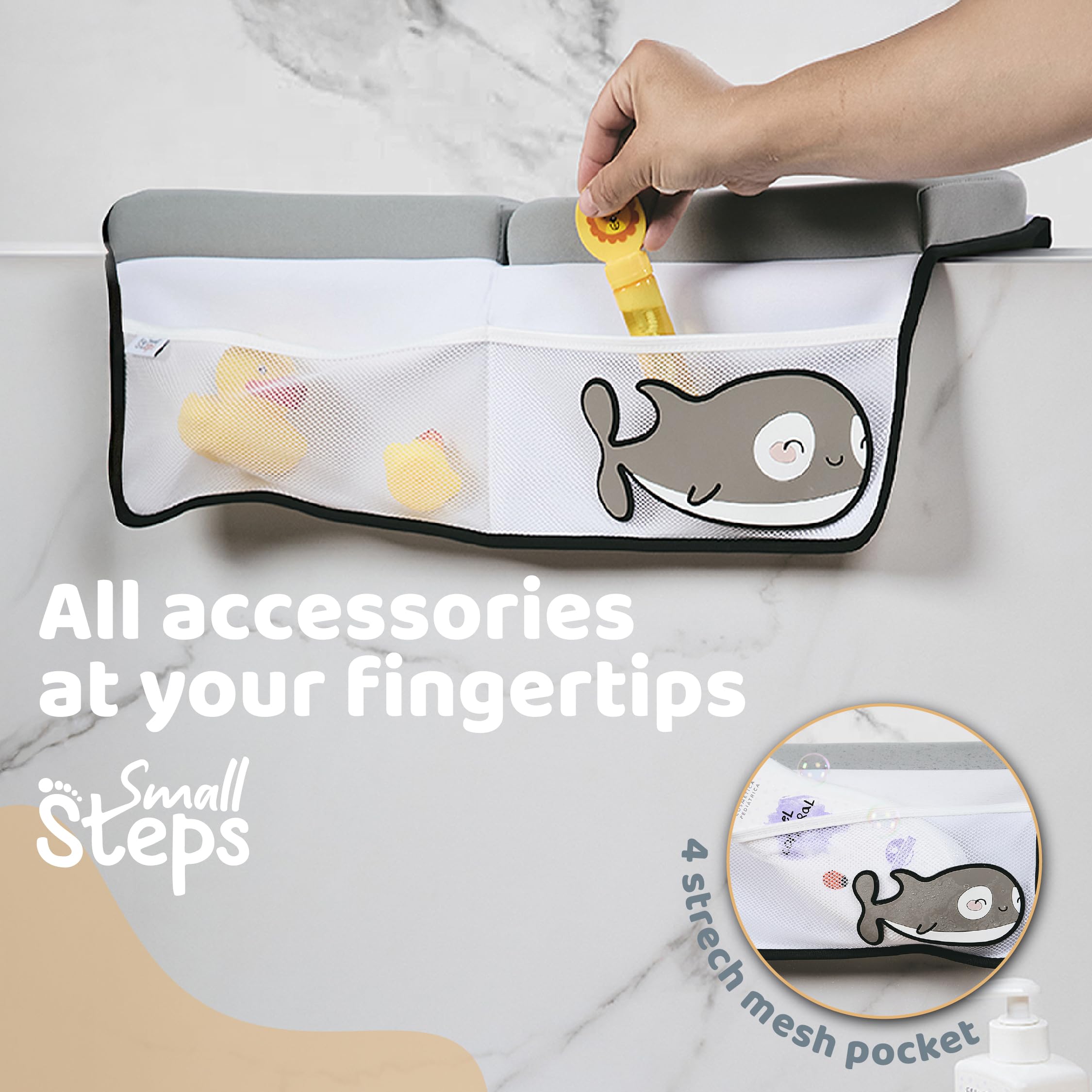 Small Steps orca toy pocket closeup shows convenient storage during baths.