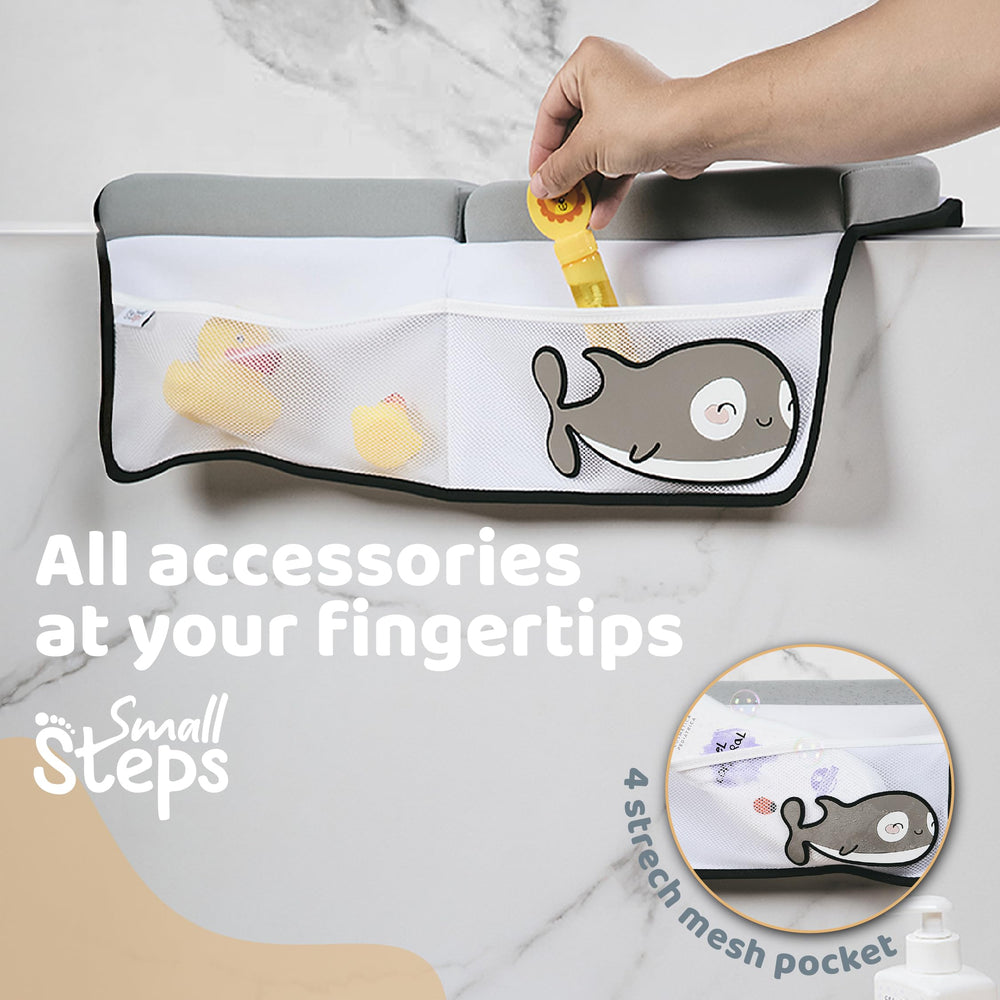 Small Steps orca toy pocket closeup shows convenient storage during baths.