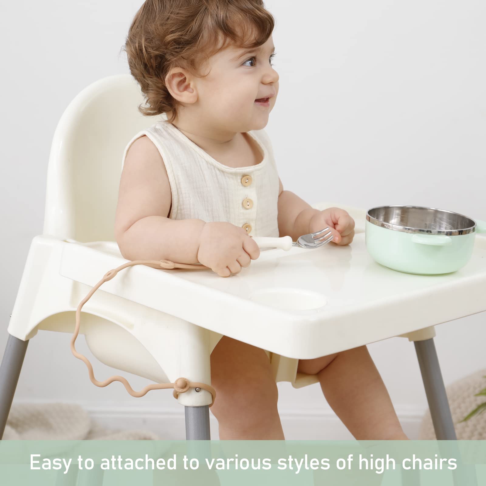 SMAutoLife utensil holder strap attached to a high chair keeps utensils within reach.
