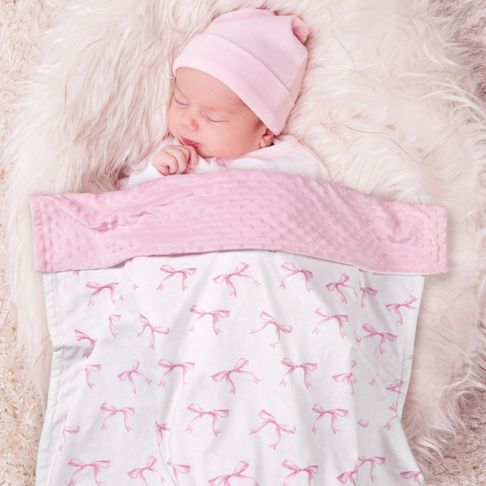 SmoothNovelty pink bow blanket is a lightweight travel essential.