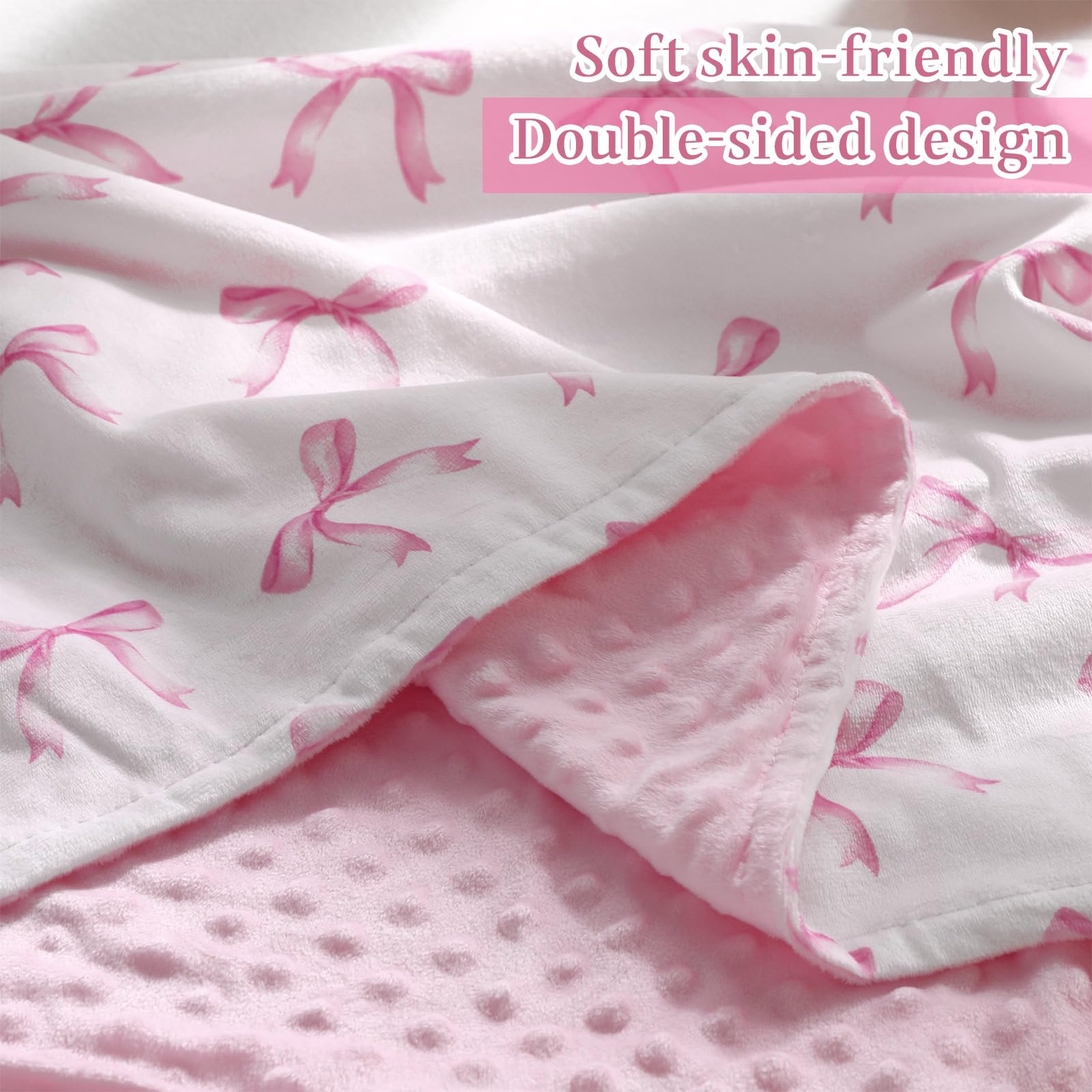 SmoothNovelty pink bow blanket with dotted back adds nursery decor charm.