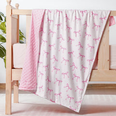 SmoothNovelty pink bow blanket: plush swaddle comfort for baby girls.