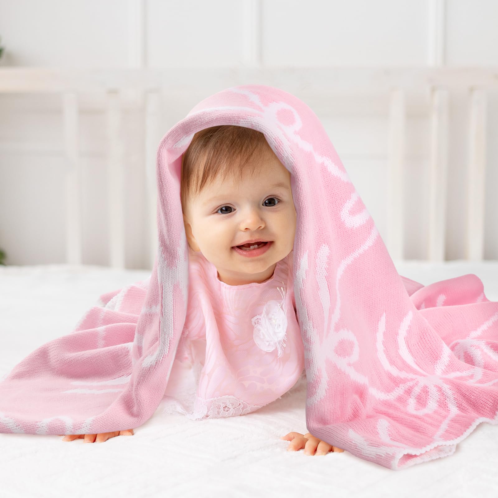 SmoothNovelty Pink Bow Knit Swaddle Blanket packaged as a thoughtful baby shower gift