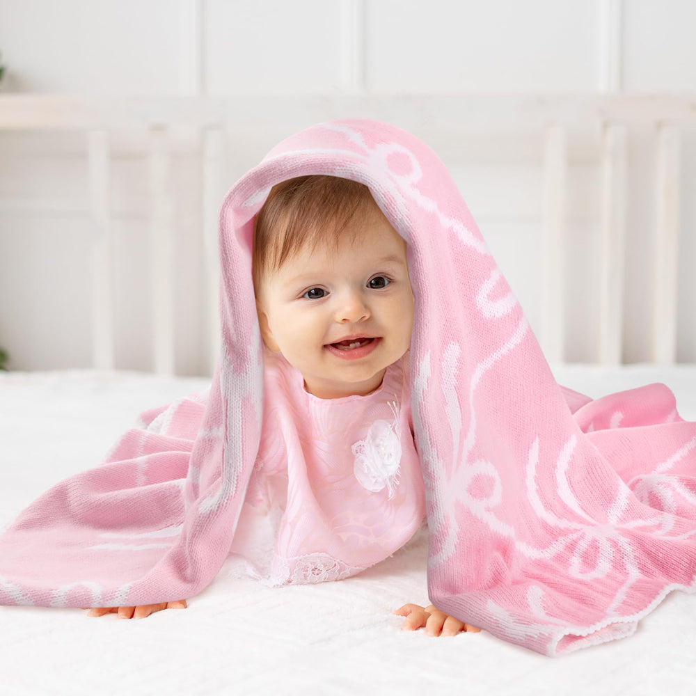 SmoothNovelty Pink Bow Knit Swaddle Blanket packaged as a thoughtful baby shower gift