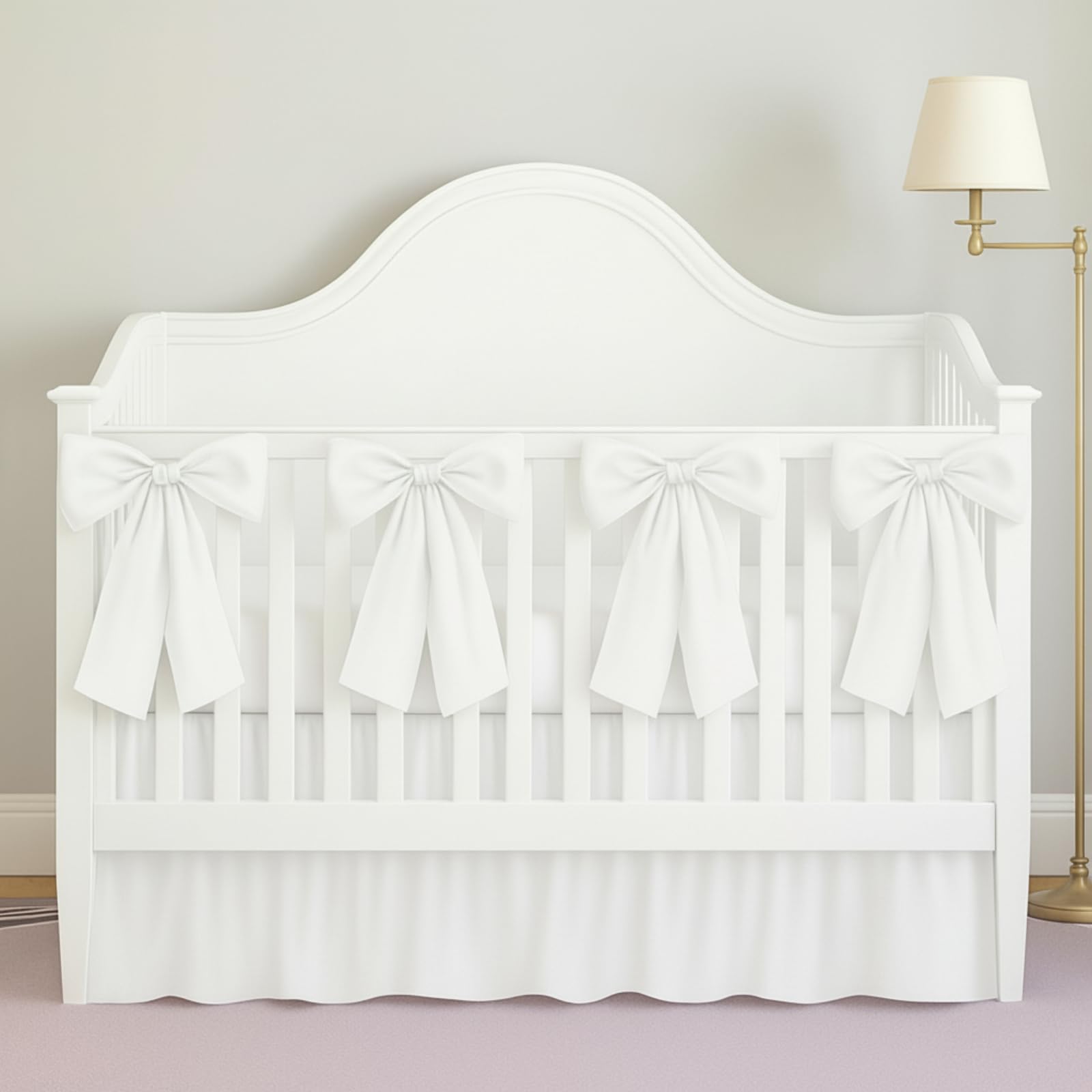 SmoothNovelty white crib skirt with 14-inch drop provides a clean, neutral backdrop for nursery decor.