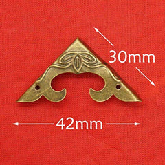 SMY bronze corner protector on jewelry case demonstrates decorative edge reinforcement.