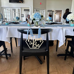 Snlioek mom-to-be chair sign on-chair view highlights the seating focal point.