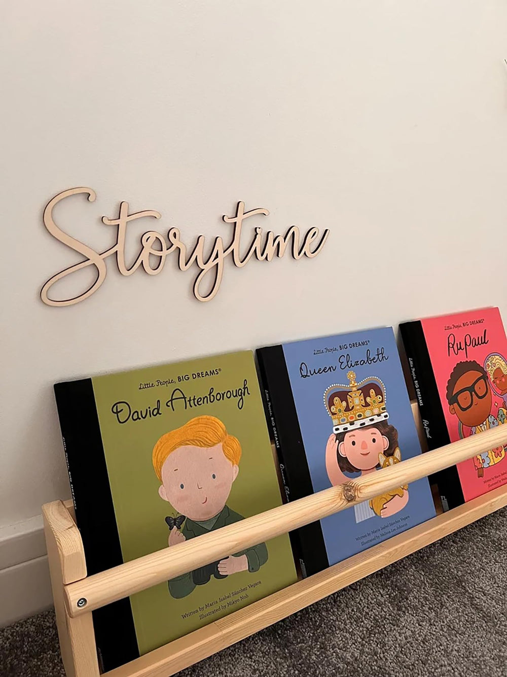 Snlioek Storytime Sign in nursery reading nook with warm wood finish