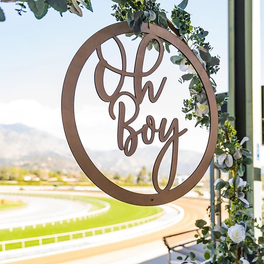Snlioek photo-setup Oh Boy Sign enhances milestone memories with natural wood texture.