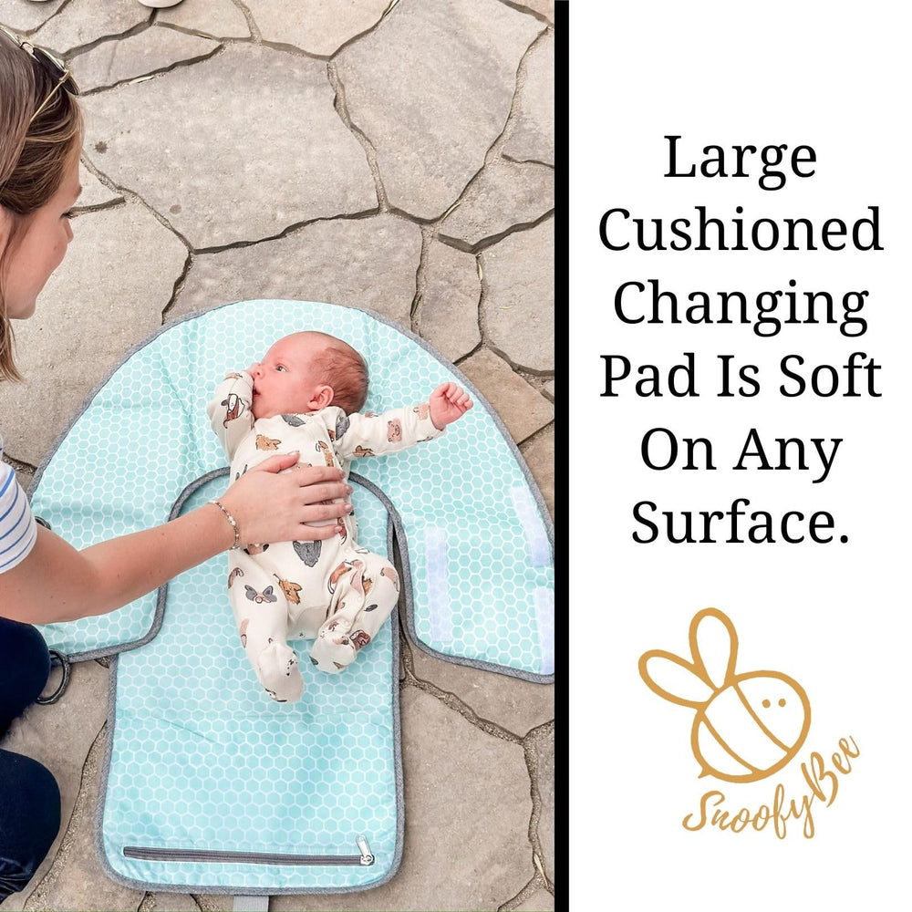 SnoofyBee clean-hands barrier with hanging toy shows mess-free diaper changes.