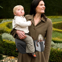 SNOOZYNEST hip seat carrier side carry demonstrates hands-free mobility for parents