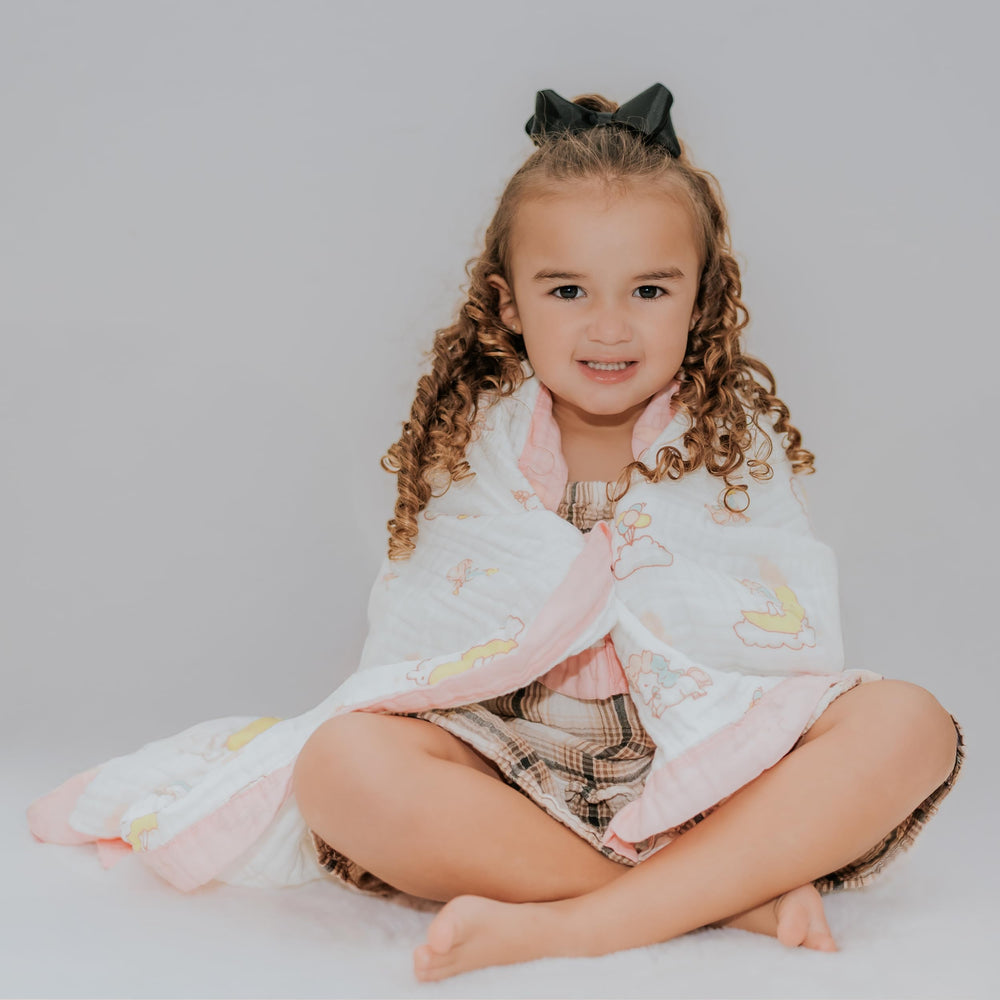 Snuggle Buds travel-friendly blanket doubles as stroller cover or car-seat companion.