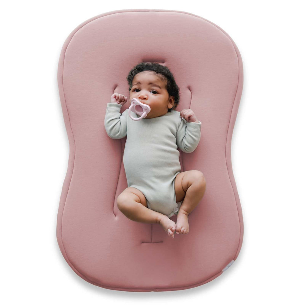 Snuggle Me Baby Lounger Curve cover close-up in buttery-soft organic cotton for newborn comfort.