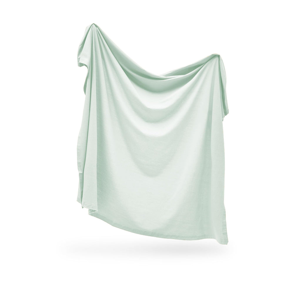 Snuggle Me Swaddle Sage stretch-detail highlights flexible fabric for cozy wraps.
