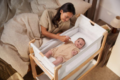 SnuzPod 4 zip-down wall feature shown for easy access during feeds