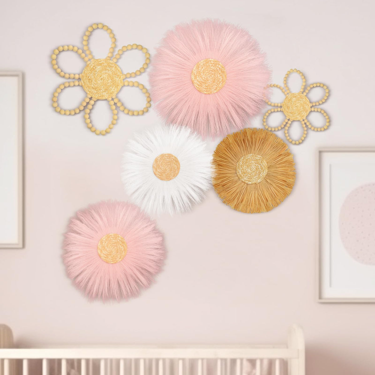 Soaoo daisy-woven-wall-hanging-pink enhances nursery decor with cheerful color and soft texture.
