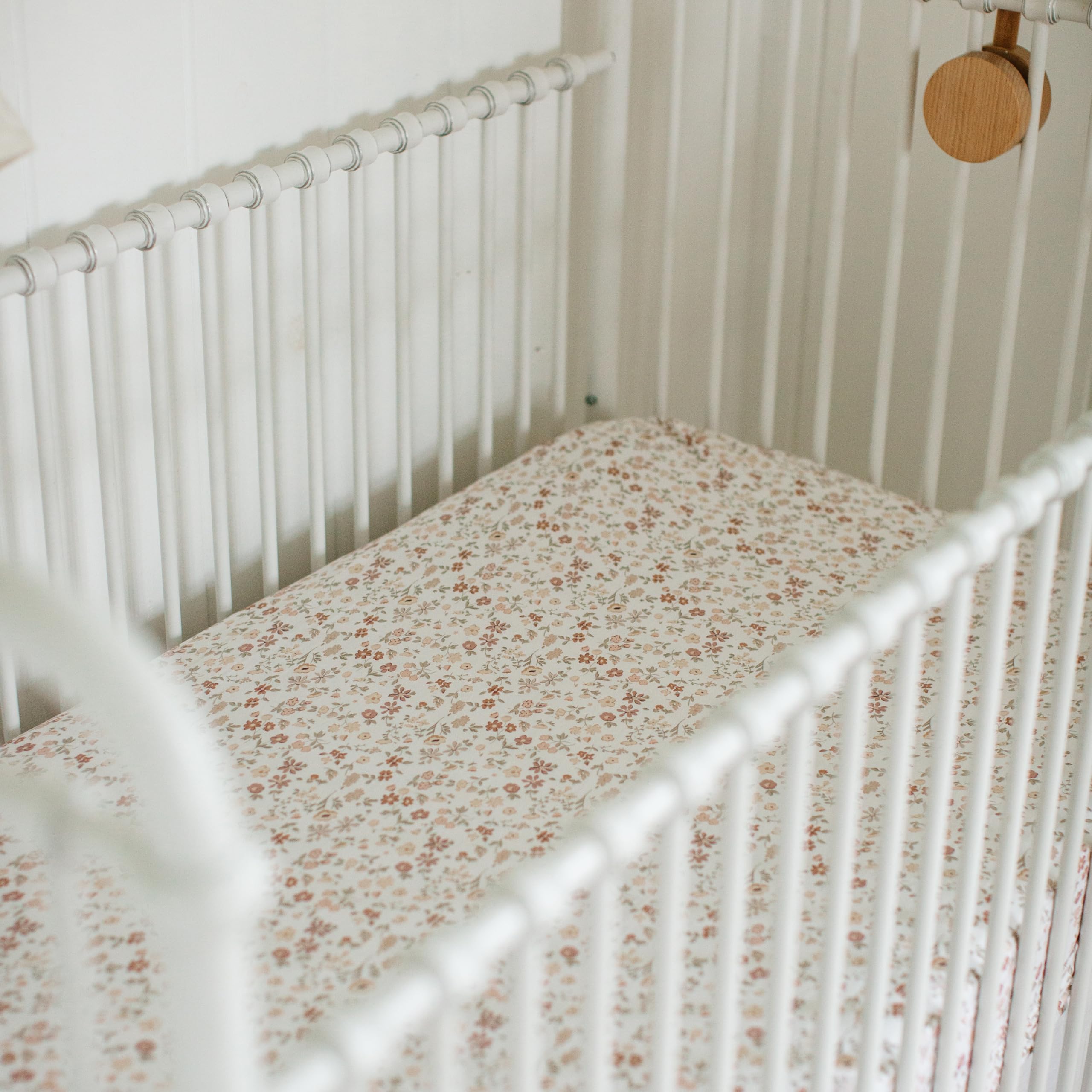 Sorrel + Fern mom-designed crib sheets reflect thoughtful nursery details.