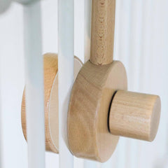 Sorrel + Fern anti-slip pads protect crib finish while securing the hanger.