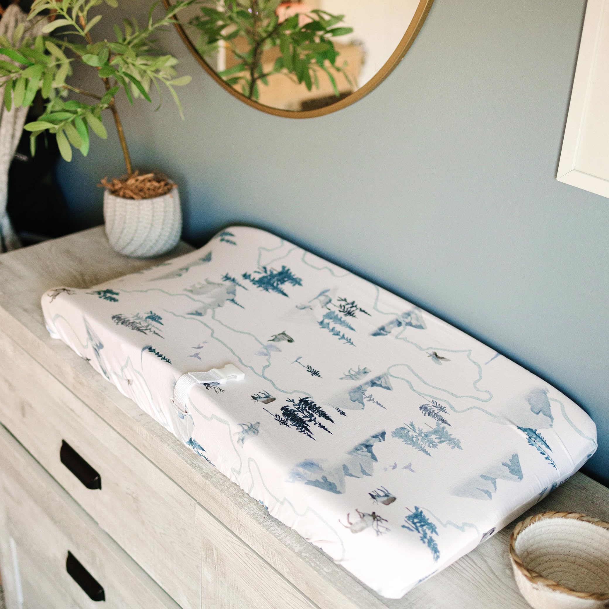 Sorrel + Fern Arctic Journey changing pad elastic stays secure for slip-free changes.