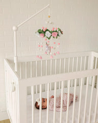 Sorrel + Fern Unicorn Blossom mobile in neutral tones enhances serene baby room aesthetics.