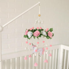 Sorrel + Fern Unicorn Blossom mobile featuring pink pom-poms for playful texture in the nursery.