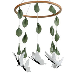 Sorrel + Fern baby crib mobile with wooden butterflies adds calming nursery decor