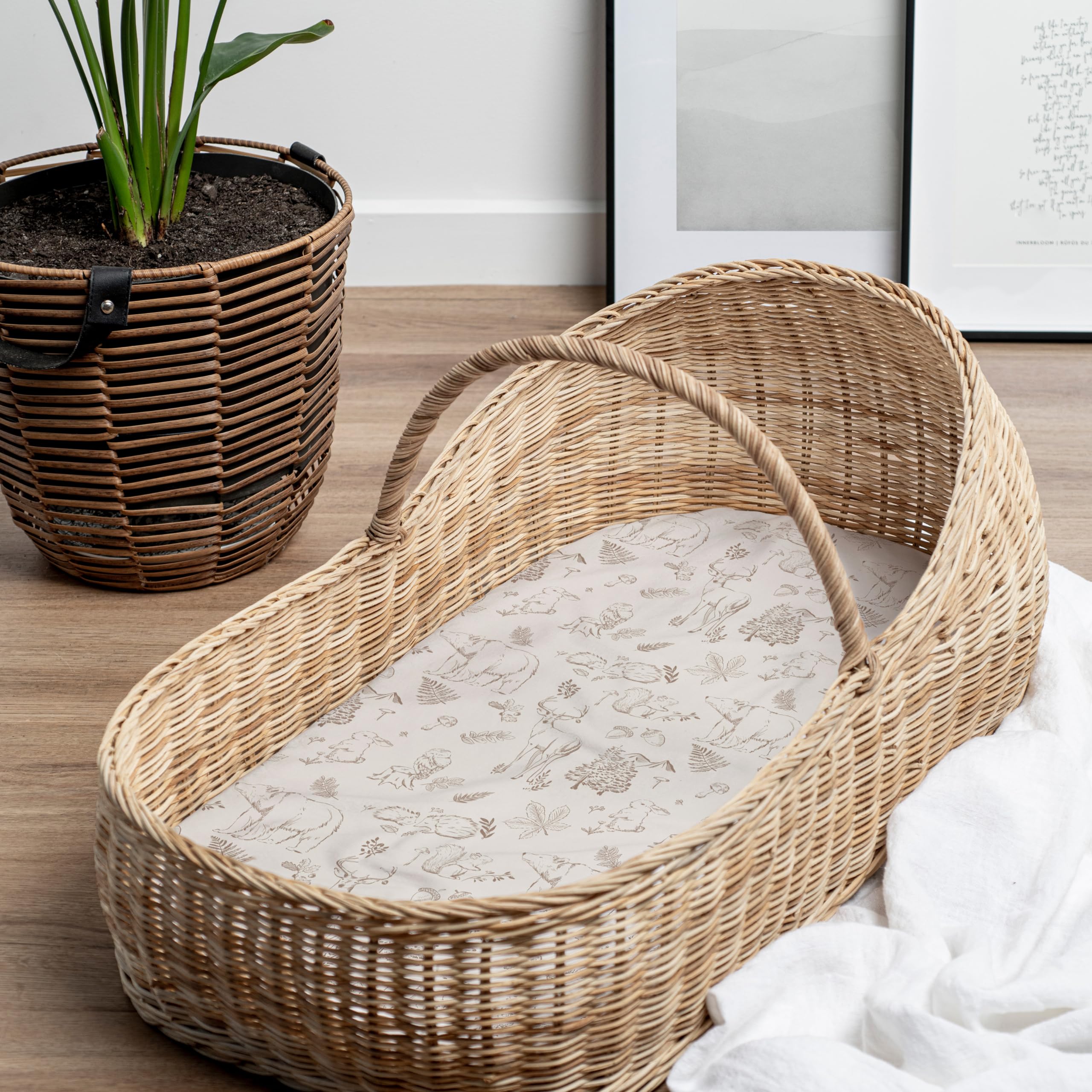 Sorrel + Fern folded bassinet sheets reveal buttery-soft cotton blend and quality.