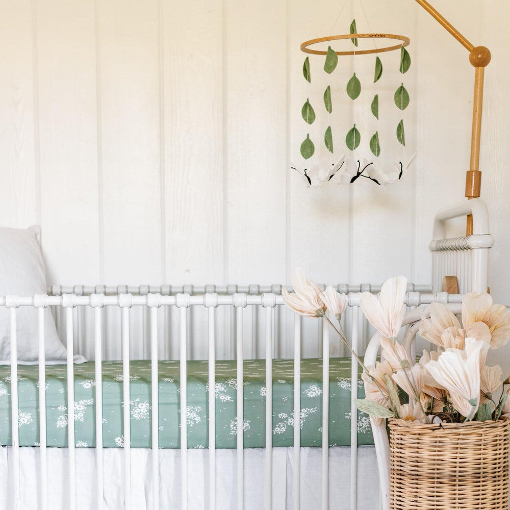 Sorrel + Fern adjustable-height butterfly mobile adapts to crib or bassinet setup