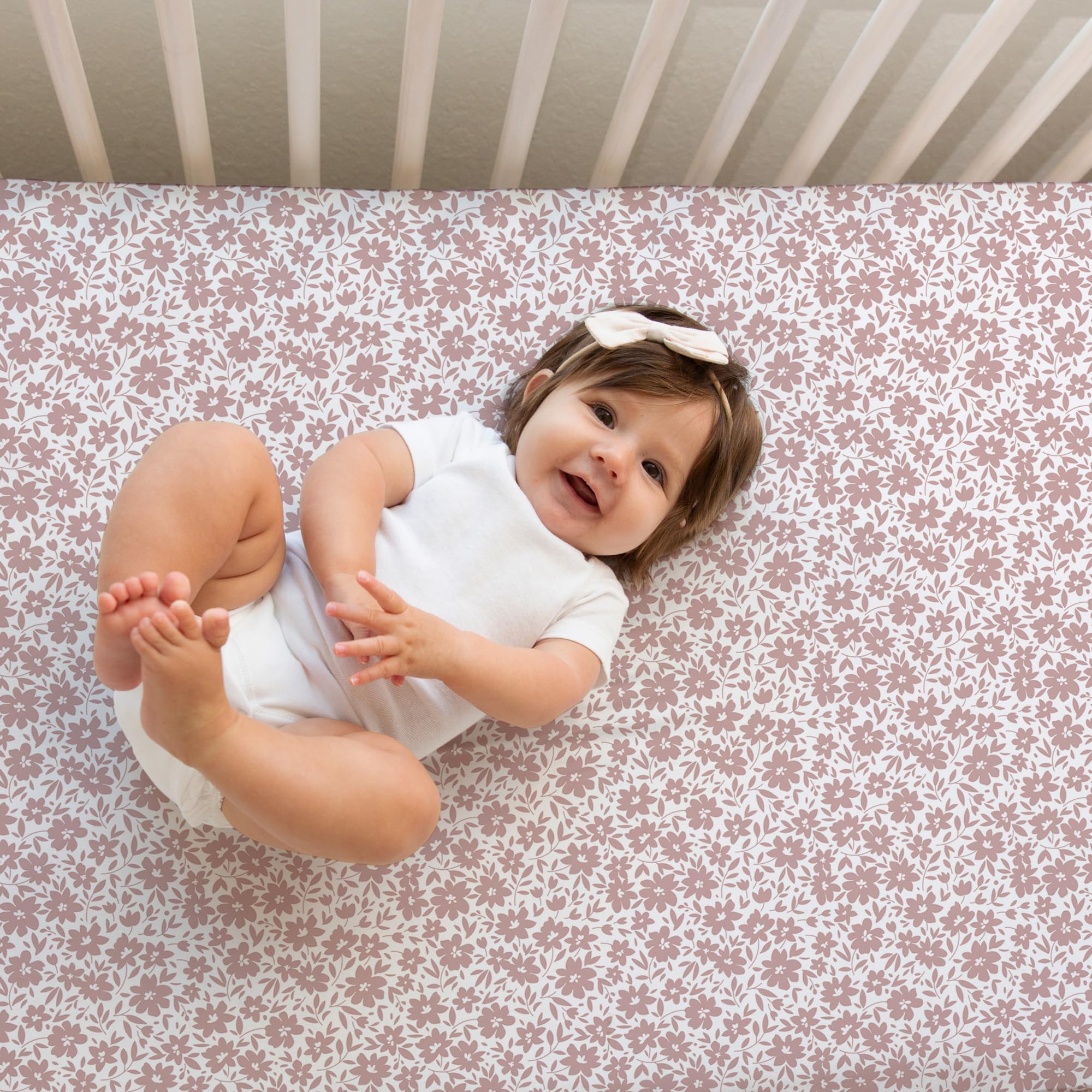 Sorrel + Fern neutral antique rose sheets on standard crib mattress for snug fit.