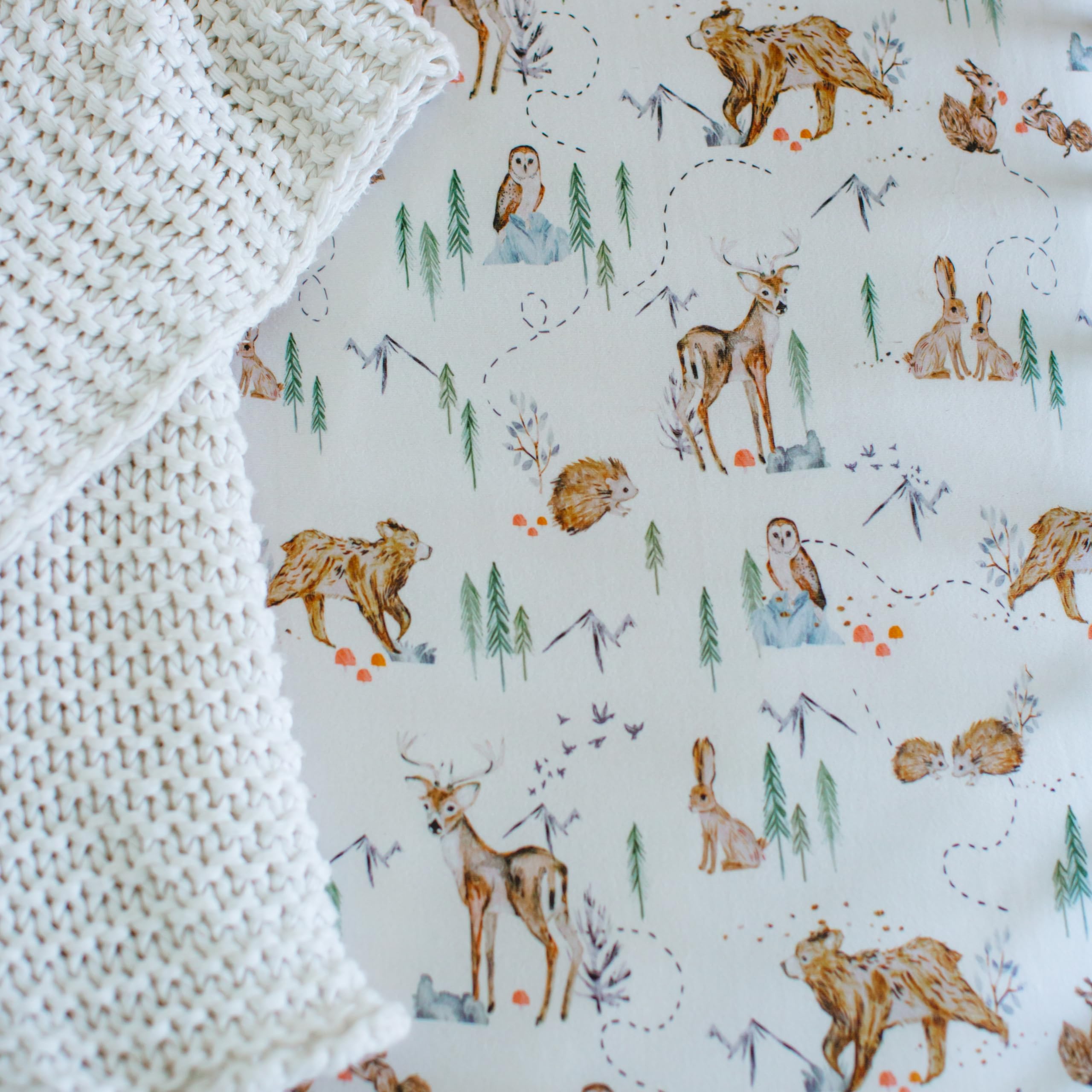 Sorrel + Fern Magic Forest nursery bedding closeup reflects calming design.