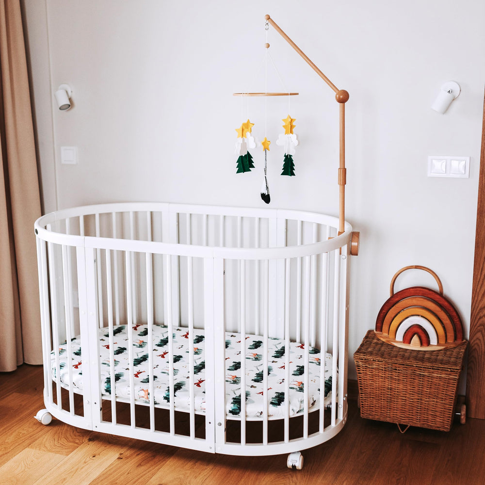 Sorrel + Fern Starry Woodland Night Mobile moon and stars provide calming night-time visuals.