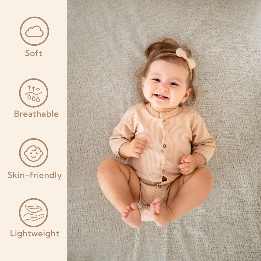 SOULFUL crib sheets elastic fit close-up shows secure flat fit on standard 28x52 mattress.
