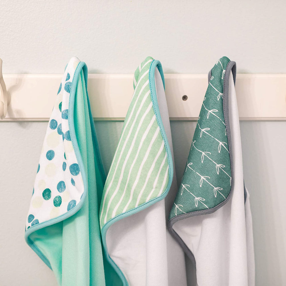 Spasilk hooded baby towel green dots closeup shows soft terry texture.