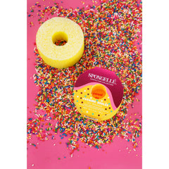 SPONGELLÉ Jasmine Brûlée buffer close-up highlights textured sponge and creamy core.