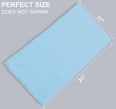 Spotted Play Aquamarine burp cloths used during a baby outfit change.