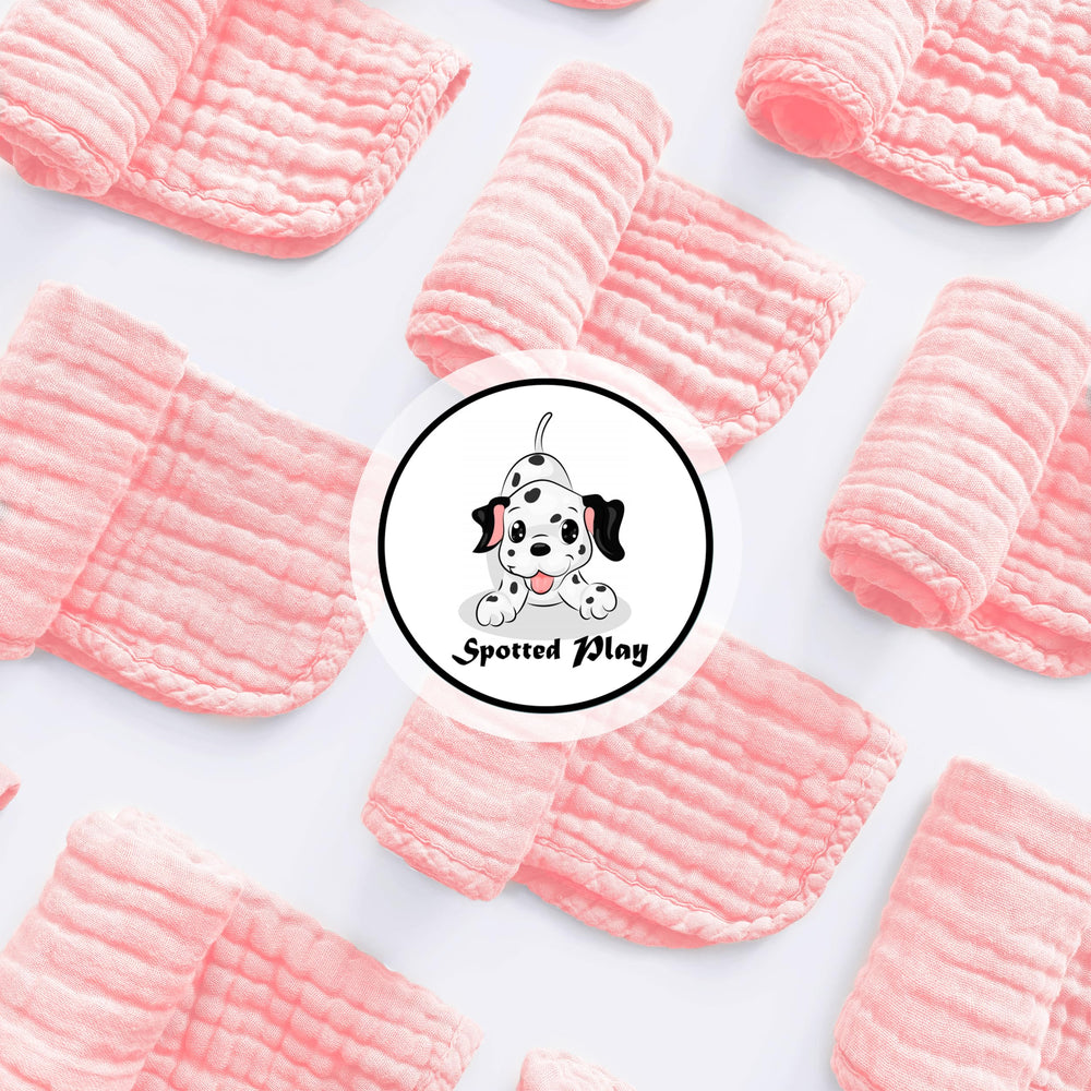 Spotted Play baby burp cloths soft cotton—gentle against sensitive skin during feeds.