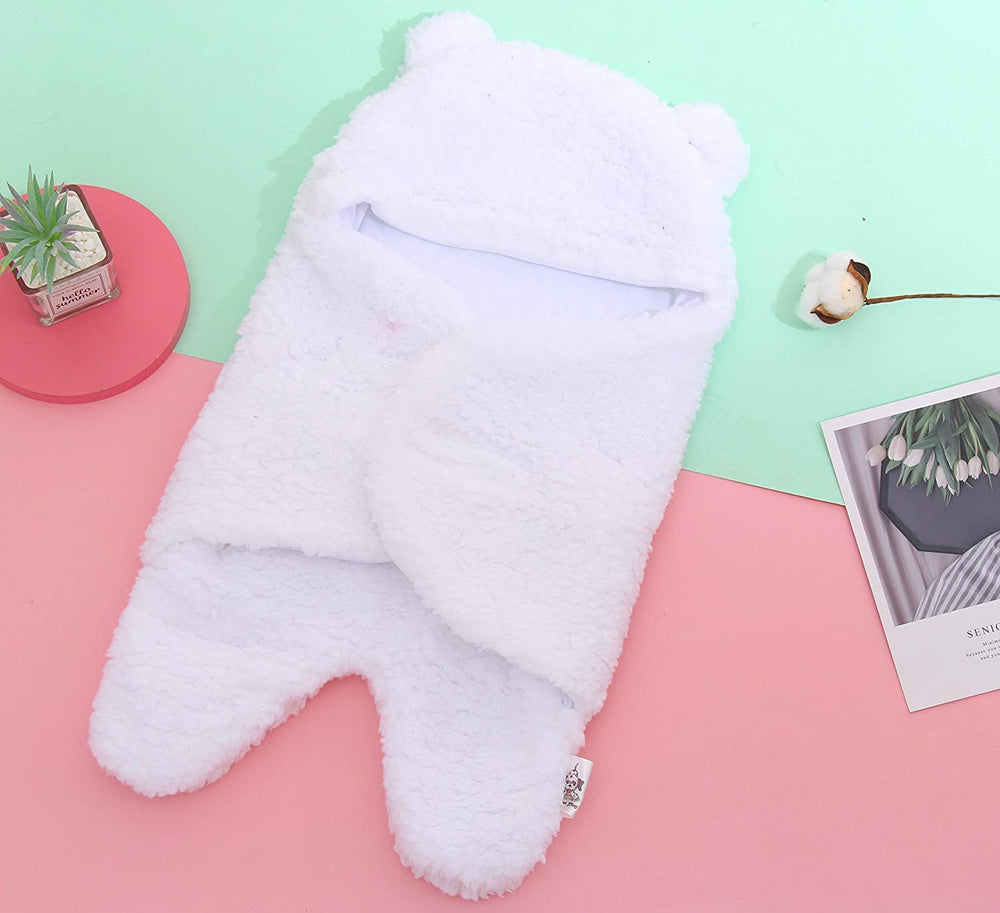 Spotted Play sherpa swaddle blanket pink-white hood close-up showing plush interior warmth