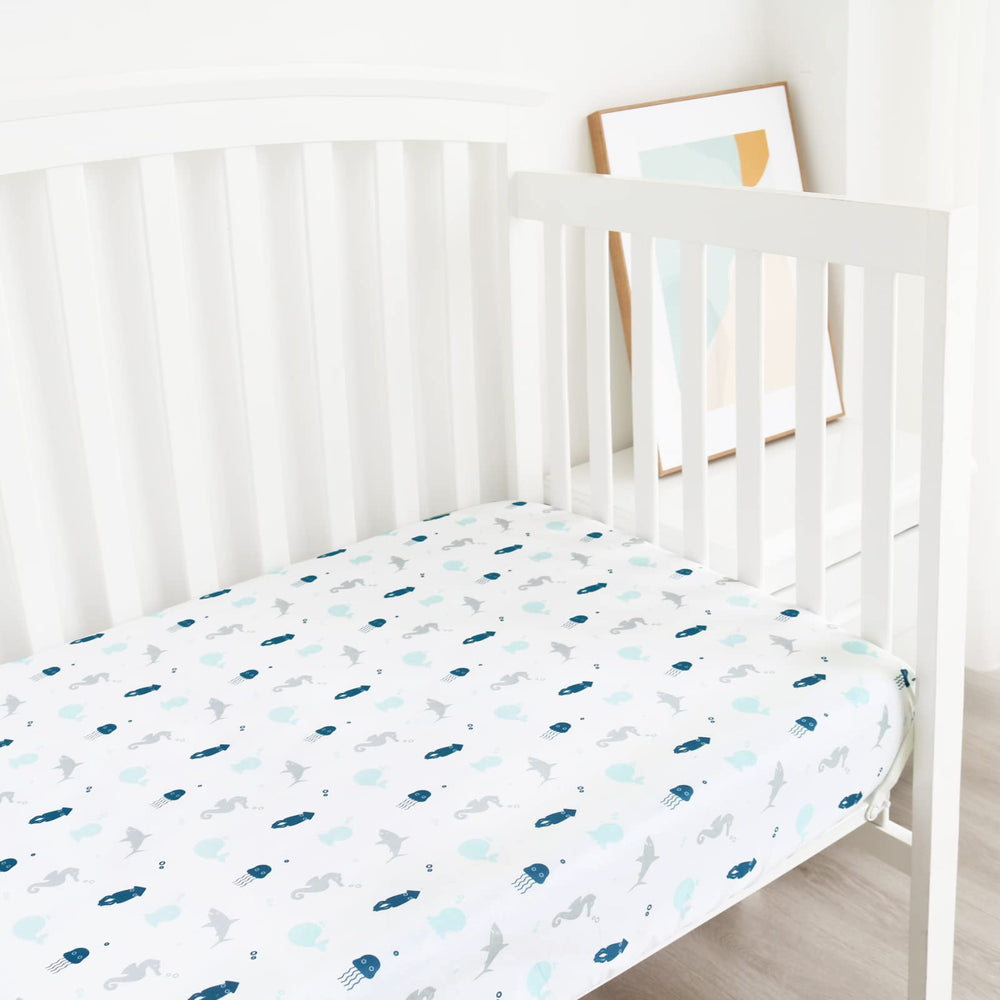 SPRINGSPIRIT bedroom scene with crib sheets showcasing neutral design