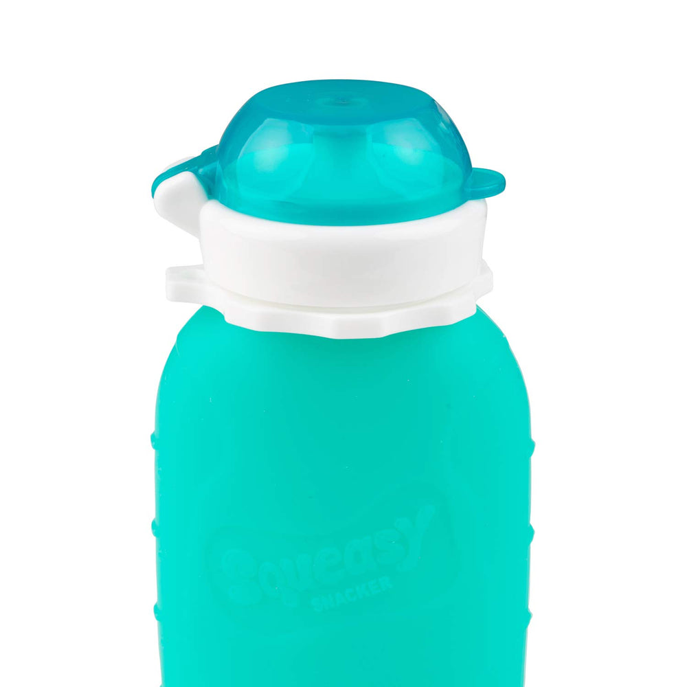 Squeasy Snacker Aqua 6oz leak-proof cap in travel setup ensuring mess-free trips