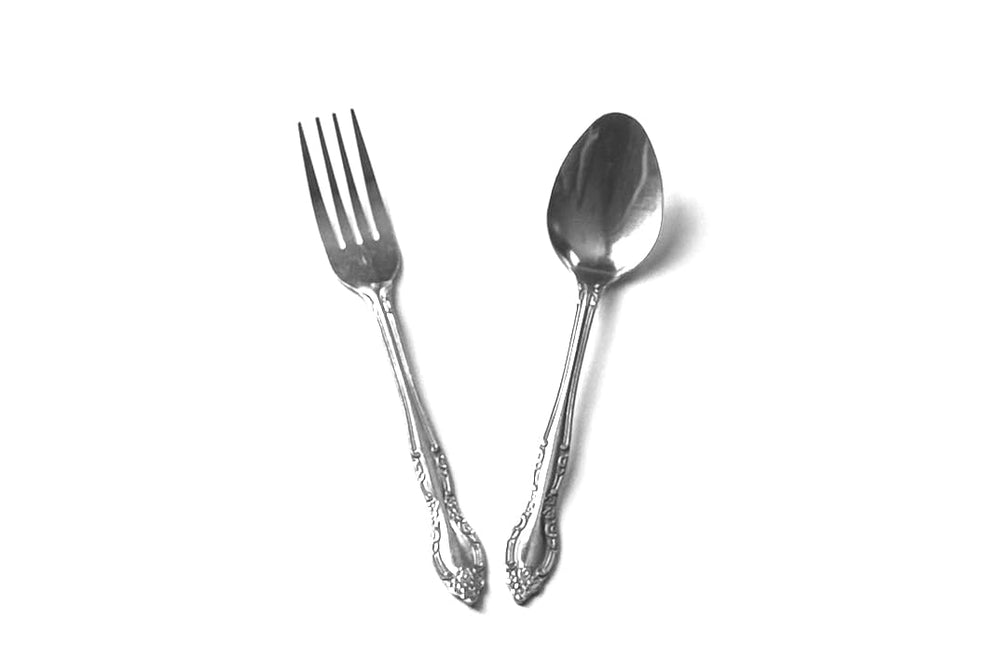 Stainless steel flatware set 24-piece spoons ideal for everyday dining and easy dishwasher care.