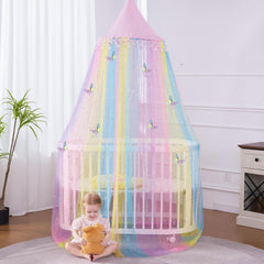 STAOLENE bed canopy rainbow-gradient-tassels adds a colorful focal point for a whimsy room.