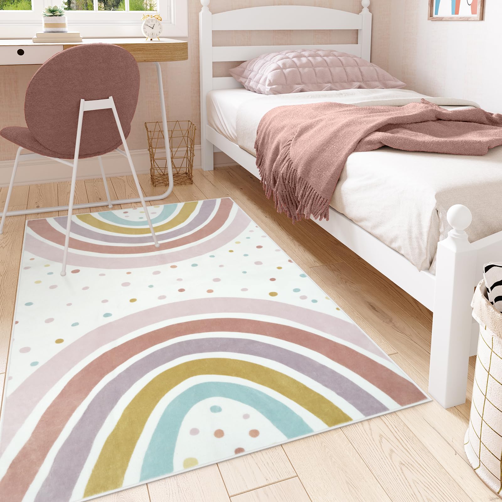 STARUIA rainbow rug top-down view highlights vibrant arches and polka dots for color learning.