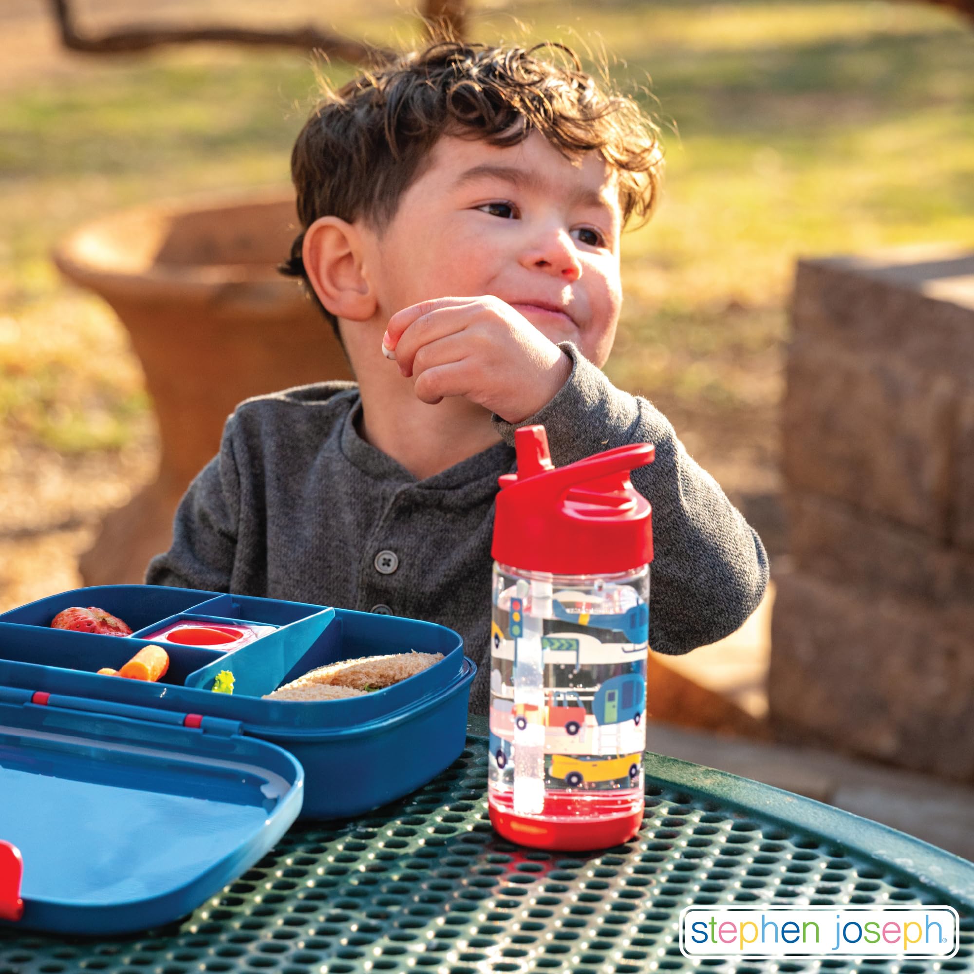 Stephen Joseph blue dino bottle fits most cup holders for school and travel.