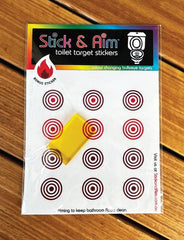 Stick & Aim toilet target with applicator tool shown for easy installation