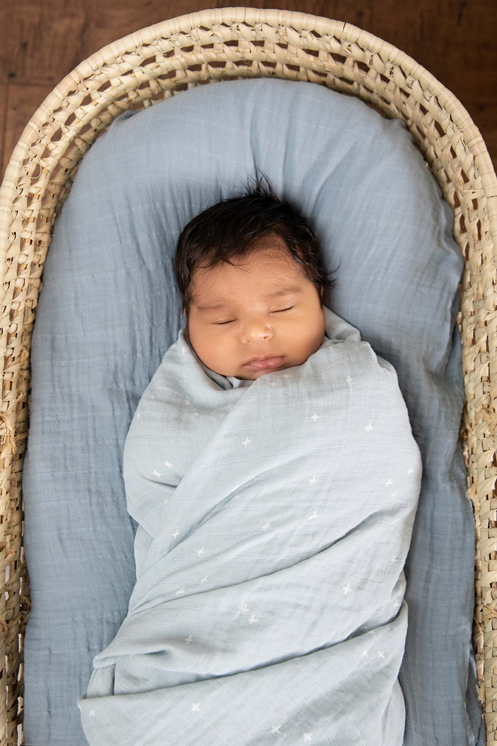 Sticky Toffee Muslin Swaddle full blanket spread with star design for versatile nursery use.